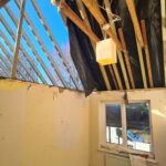 Internal view from existing house showing newly installed ceiling joists and structural supports