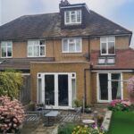 External east-facing view of the house after the loft conversion with new rear box dormer window