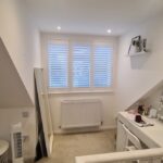 Internal view of the completed loft bedroom showing improved headroom, natural light and stairwell access