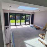 During renovation view showing new herringbone flooring, modern finishes and open-plan layout forming