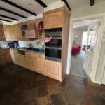 Internal view of the original kitchen before extension, looking through toward the front lounge