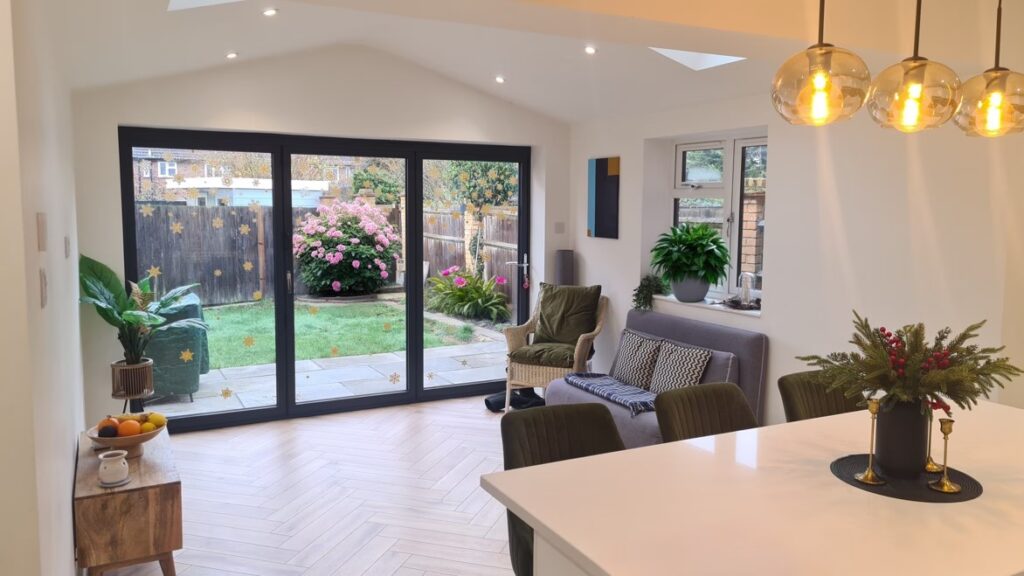 Light-filled single storey rear extension with full-width glazing opening onto the garden, creating a bright family living space.